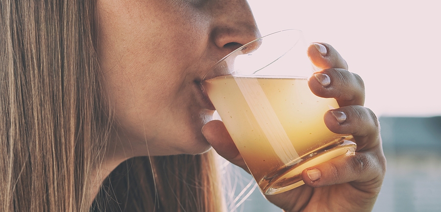 unaware woman drinking contaminated water